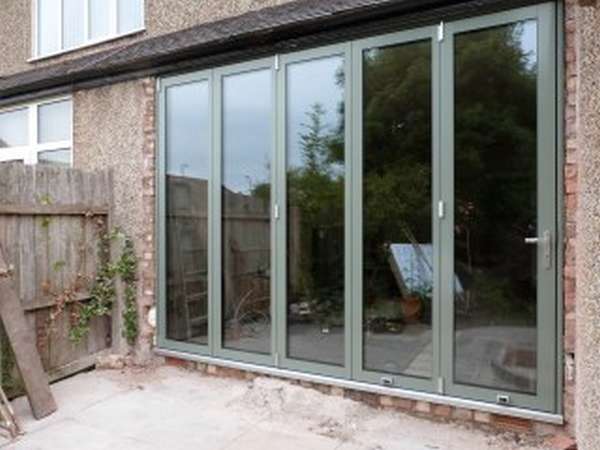 Mold North Wales - New Build extention of Centor C1 Bi fold doors triple glazed with 44mm units. Sating chrome threshold in a bespoke RAL to the Clients choice
